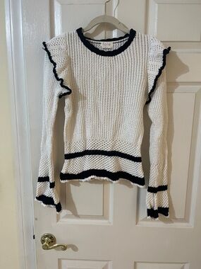 White crochet sweater with black trim
Size M